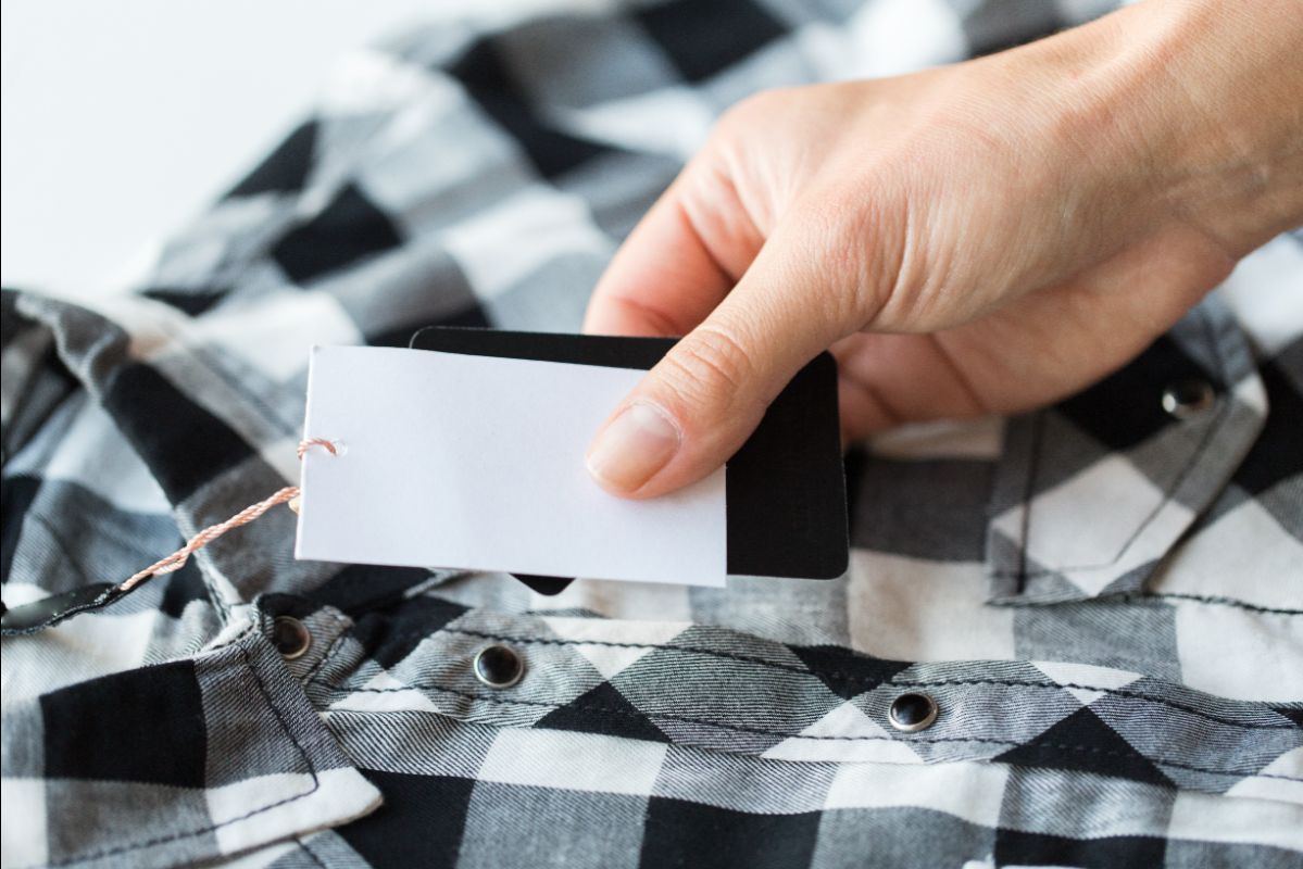 Label applied to a shirt by apparel tagging gun