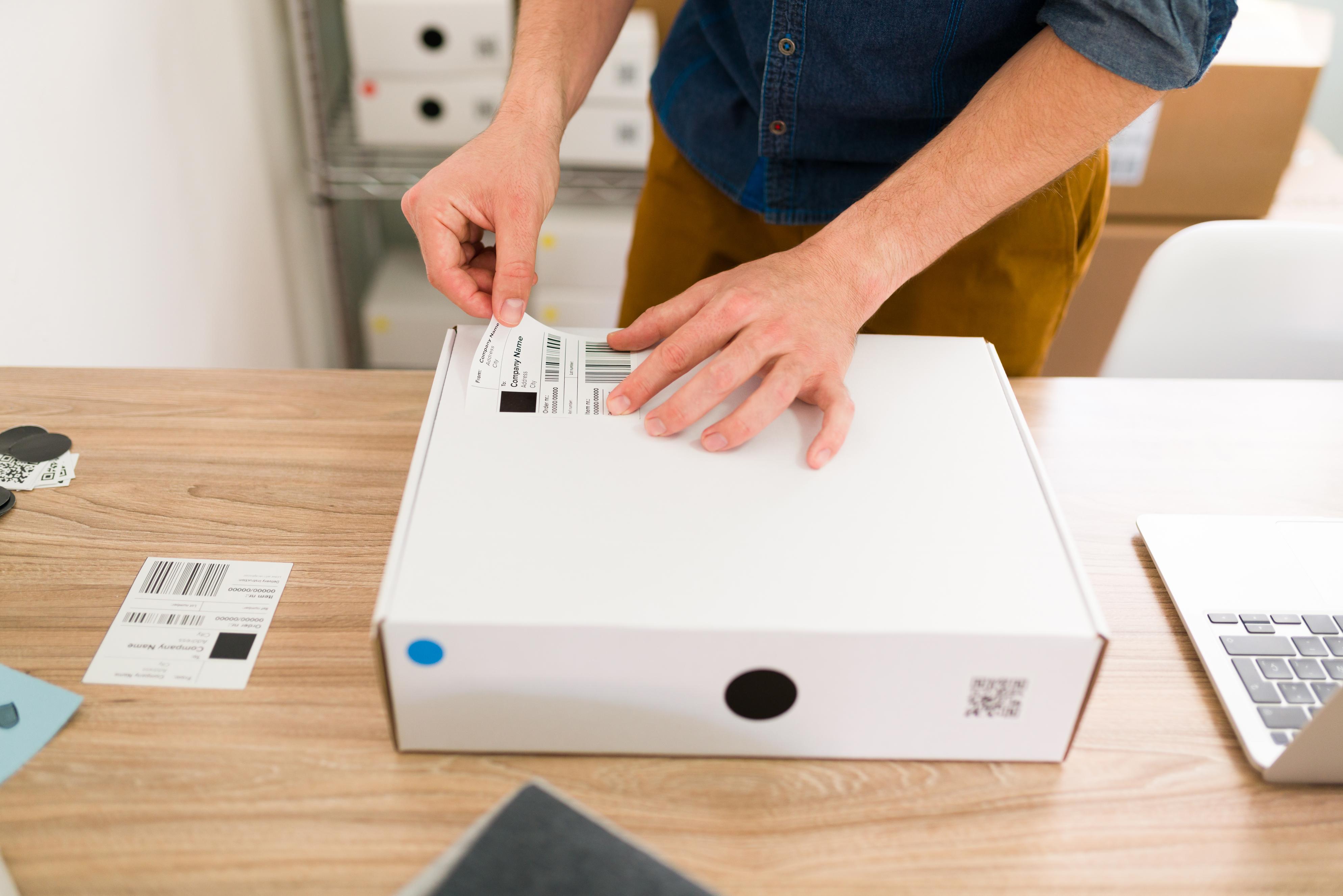 Printing shipping label from a regular printer being applied to a package