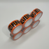 Pack of orange Urgent Tape